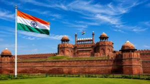 Indian national flag flying above the Red Fort in Delhi under a bright blue sky, symbolizing India’s Independence Day spirit.